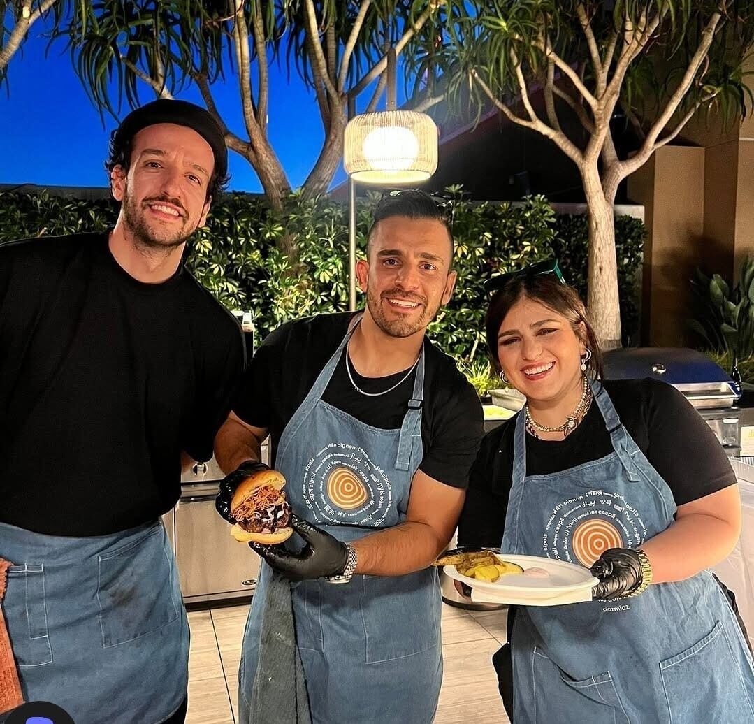 Chef Piaz with his team in aprons